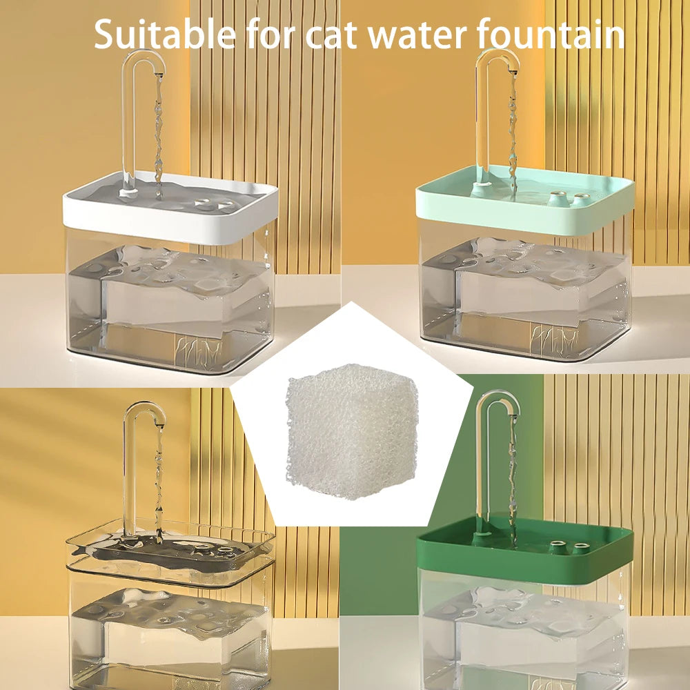 Clear glass water fountain with an activated carbon replacement filter and a stainless steel spout.