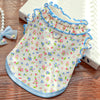 A floral princess pet dress for dogs and cats in white fabric with blue trim