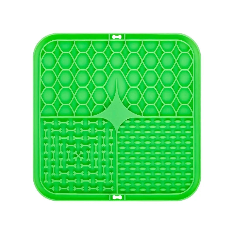 A bright green silicone lick mat with a honeycomb pattern for dog training and slow food.