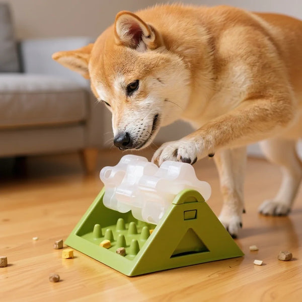 An orange dog is interacting with a green puzzle feeder for dog food.