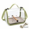 A portable bird travel carrier with a transparent viewing panel and a wooden dining plate.