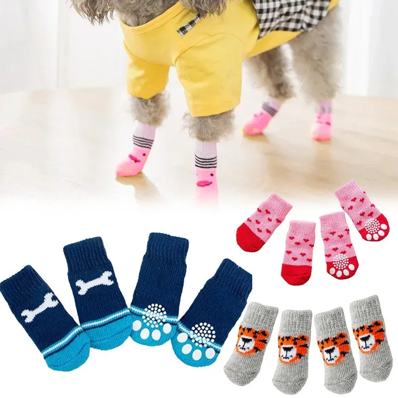 A pack of four anti-slip knit dog socks featuring a tiger design in various colors and patterns.