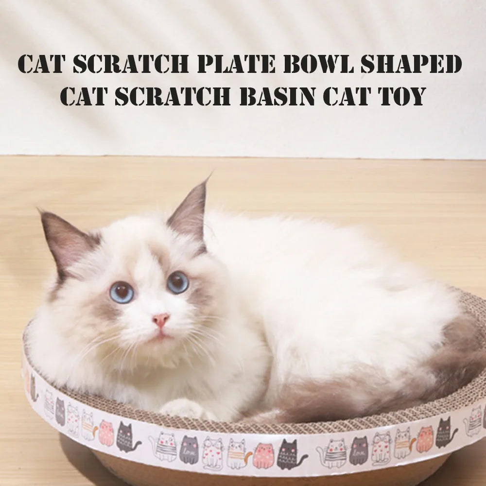 A fluffy white and gray cat is relaxing inside a bowl-shaped scratching basin for cats.