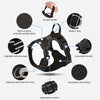 A black reflective dog harness showing various features like a no-pull handle, metal D-ring, and adjustment system.