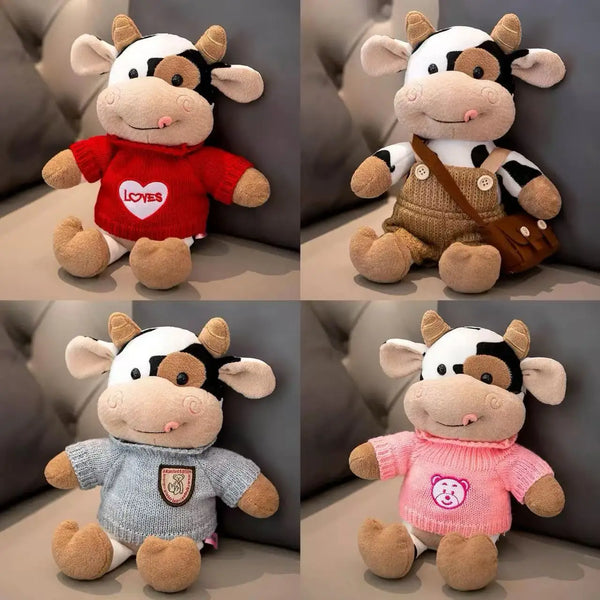 A collection of soft cow plush toys in various colors and styles, including red, brown, and pink.