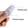A hand holds a white dog training clicker and whistle device, showing the whistle hole and clicker buttons.