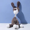 A handmade plush toy of a donkey dog with dark brown fur and white accents, featuring a teeth cleaning texture.