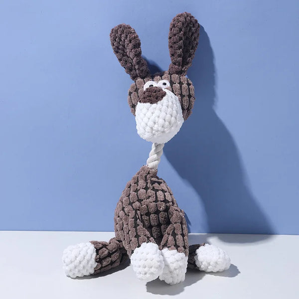 A handmade plush toy of a donkey dog with dark brown fur and white accents, featuring a teeth cleaning texture.