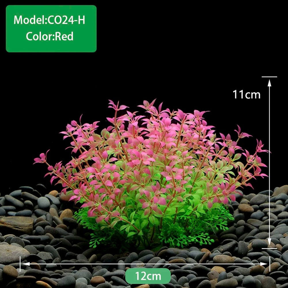 A dense cluster of red and green artificial aquarium plants growing in dark gravel.
