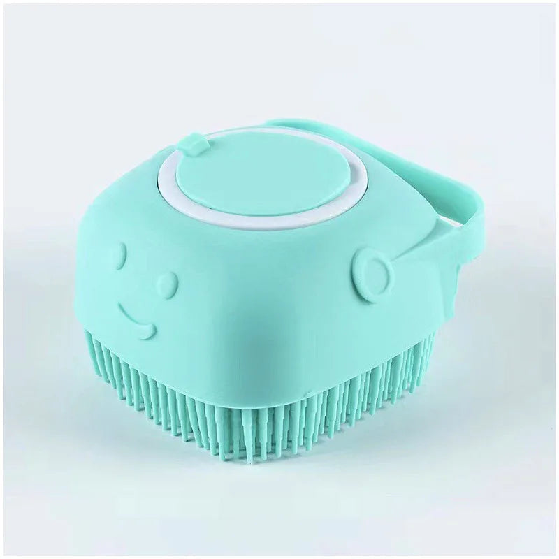 A light blue silicone pet bathing massage glove with a rounded head and bristled base.