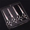 A black case holds a professional stainless steel pet grooming scissors set with various blades.