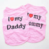 Pink vest with black text saying I love my Daddy and Mommy for pets