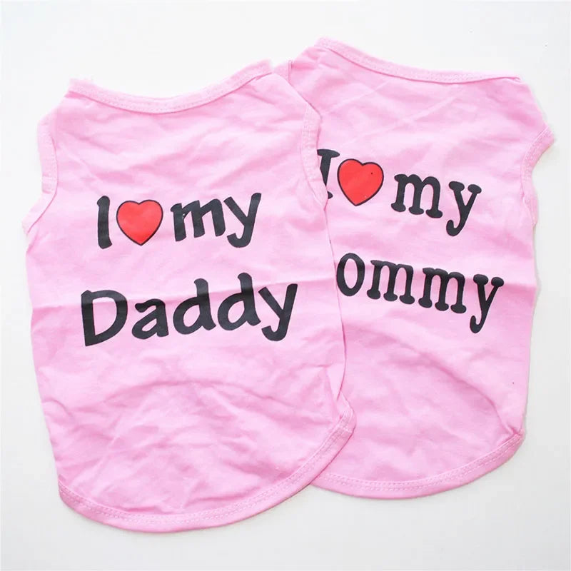 Pink vest with black text saying I love my Daddy and Mommy for pets