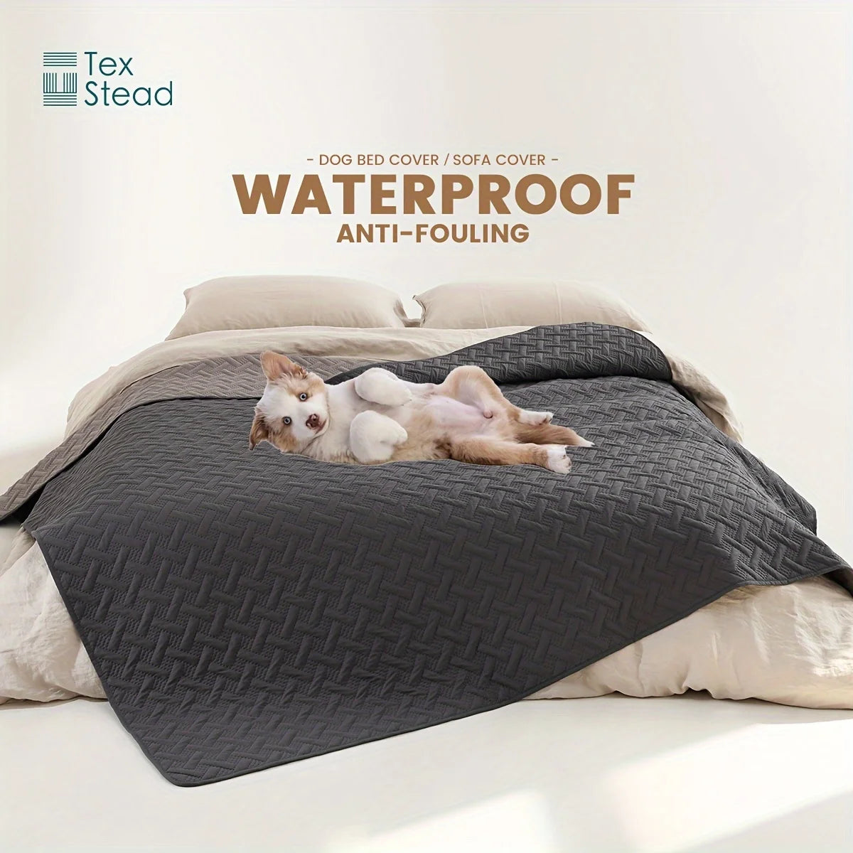 A gray waterproof dog bed cover is shown with a pet resting on it, placed on a light-colored bedding.