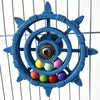 A blue interactive parrot spinner rattle toy with a central mechanism and colorful plastic balls.