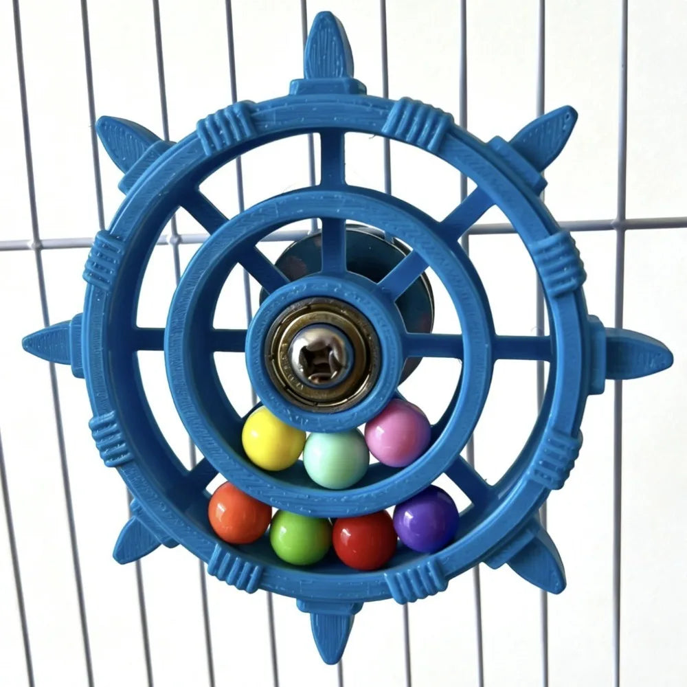 A blue interactive parrot spinner rattle toy with a central mechanism and colorful plastic balls.