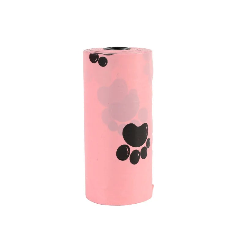A roll of pink biodegradable dog waste bags with a dispenser visible.