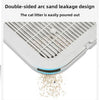 A close-up view of a white double-sided arc sand leakage design cat litter mat with sand spilling out.