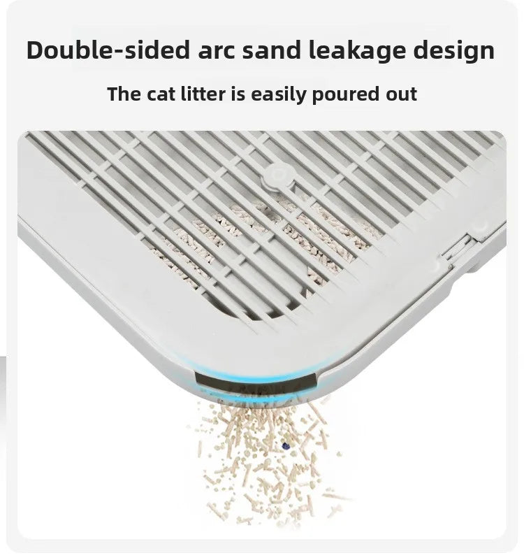 A close-up view of a white double-sided arc sand leakage design cat litter mat with sand spilling out.