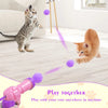 Pinkes interaktives Plüschkatze-Waffenspiel mit violetten Lichtstrahlen, das eine Kätzchen in einem Raum trifft.