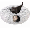 A black cat is peeking out of a fluffy gray plush tunnel bed for a cozy hideaway.