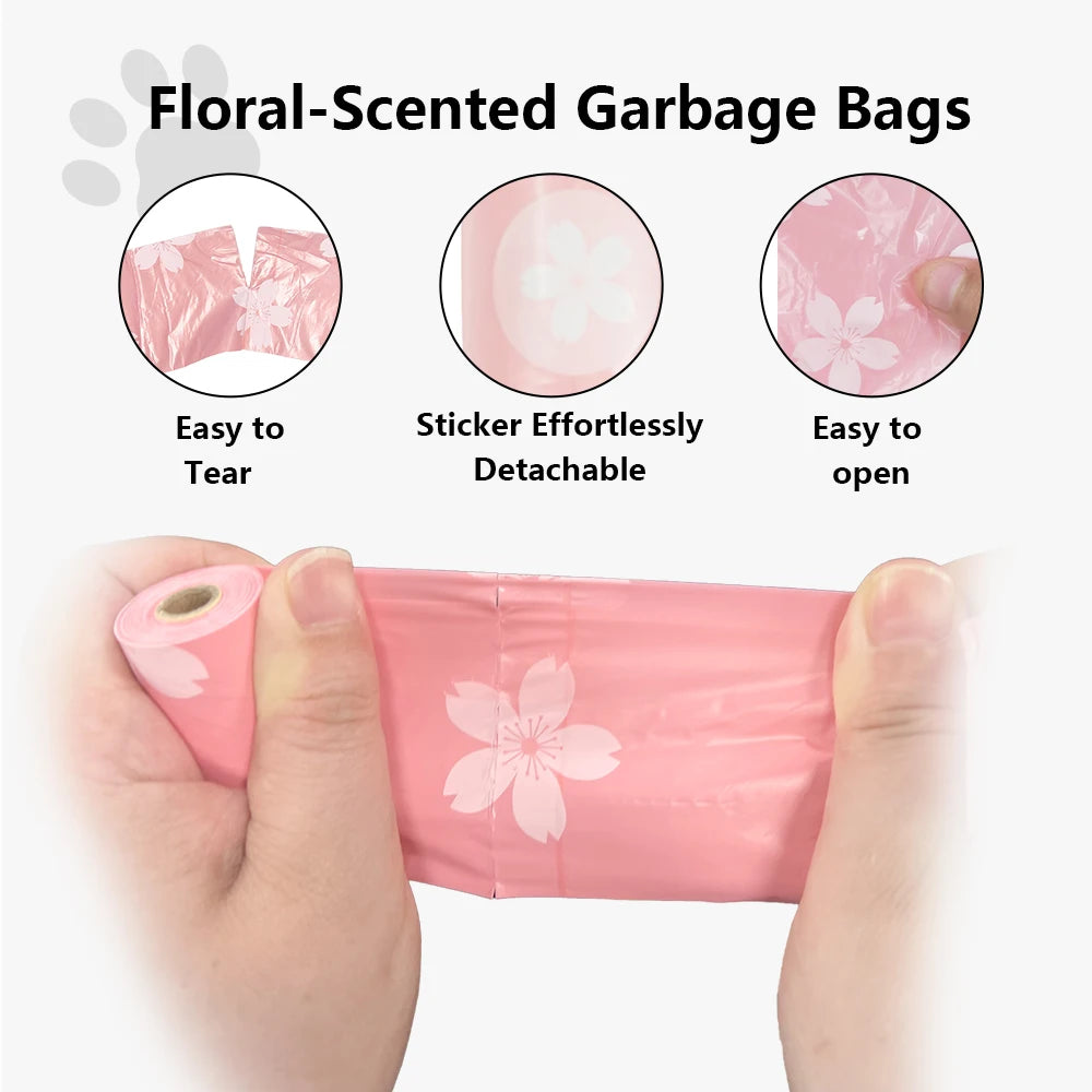 Pink floral-scented garbage bags being held by a hand, demonstrating easy tear and opening features.