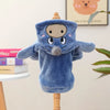 A blue flannel hoodie shaped like a dog is displayed on a wooden stand.