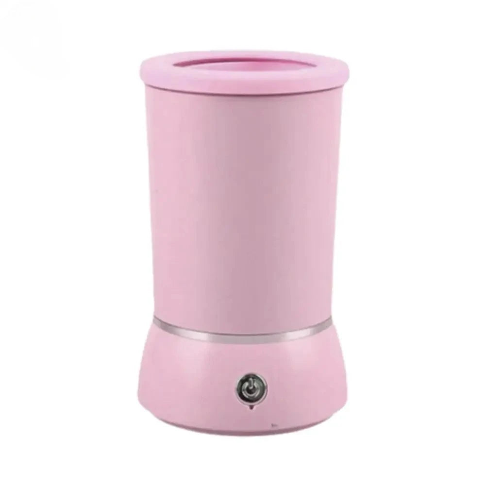 A pink automatic pet paw cleaner cup with a visible charging port.