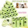 A stack of light green pet poop bags and several dog breeds are shown for sale.