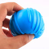A hand holds a bright blue, ribbed rubber chew toy for small dogs.