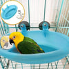 Un bol distributeur automatique de nourriture pour oiseaux bleu vif avec un perroquet jaune perché à l'intérieur.