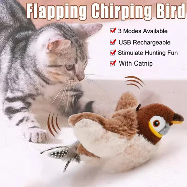 A fluffy, brown and white bird toy with flapping wings is shown next to a tabby cat.