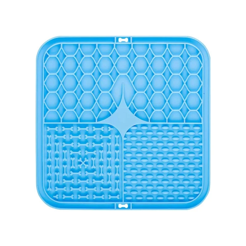 A blue silicone lick mat with a hexagonal pattern for dog bathing and slow food training.