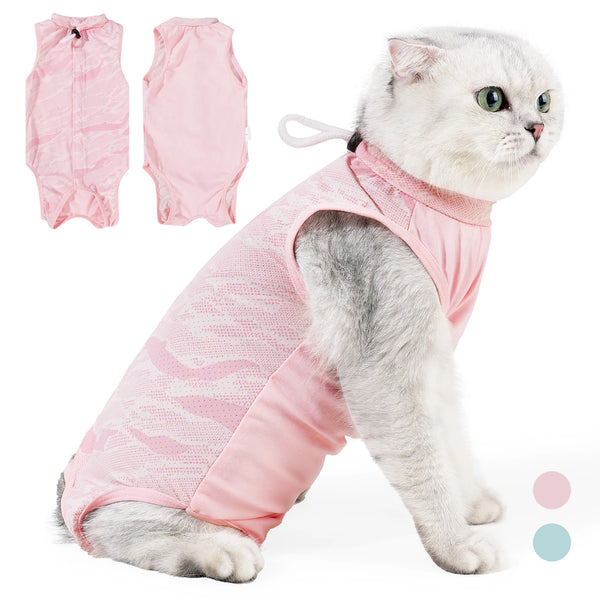 A white cat wearing a pink post-surgery recovery onesie for cats.
