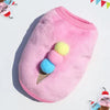Pink cozy fleece puffer vest with blue pom-pom accents for small pets