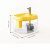A clear glass cat drinking fountain with a yellow lid and a silver spout, shown from above.