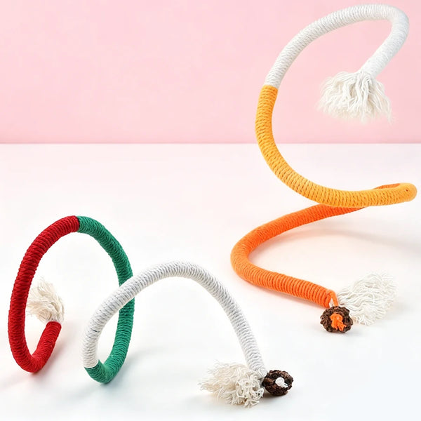 A set of interactive teeth grinding rope toys for cats in red, green, and orange with fluffy ends.