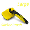 A large yellow slicker brush with a black handle is shown against a white background.