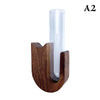 A wooden pet whisker collector vase with a clear glass tube.