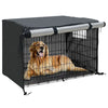 A black waterproof dog crate cover with a metal grate and a silver roll-up sun and weather protection tube.