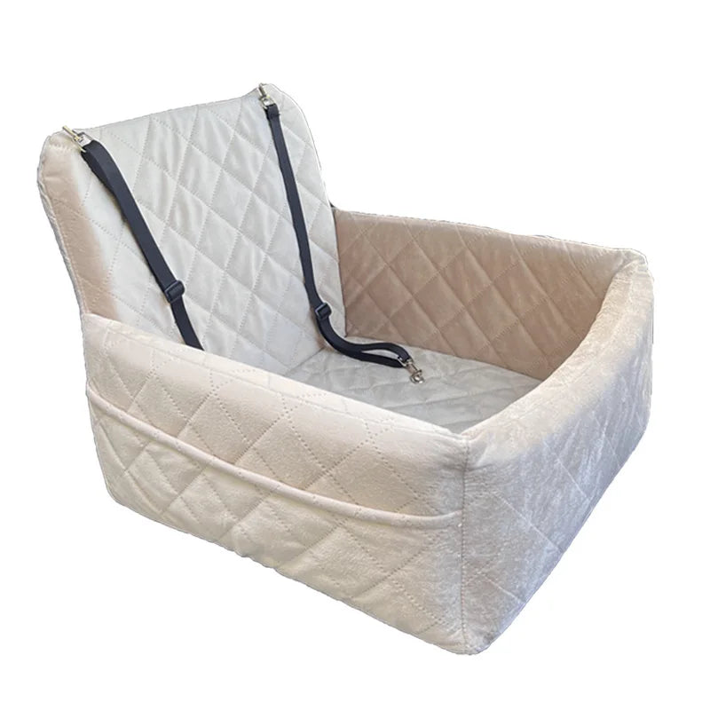 A beige quilted dog car seat with a removable orthopedic cushion and black straps.