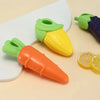 A set of carrot and corn shaped squeaky chew toys for dogs in orange, yellow, and green colors.