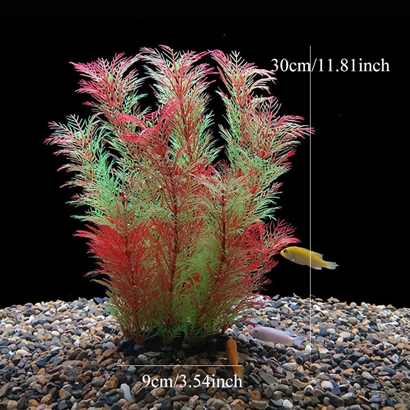 Plante aquatique artificielle rouge et verte dans un substrat de gravier.