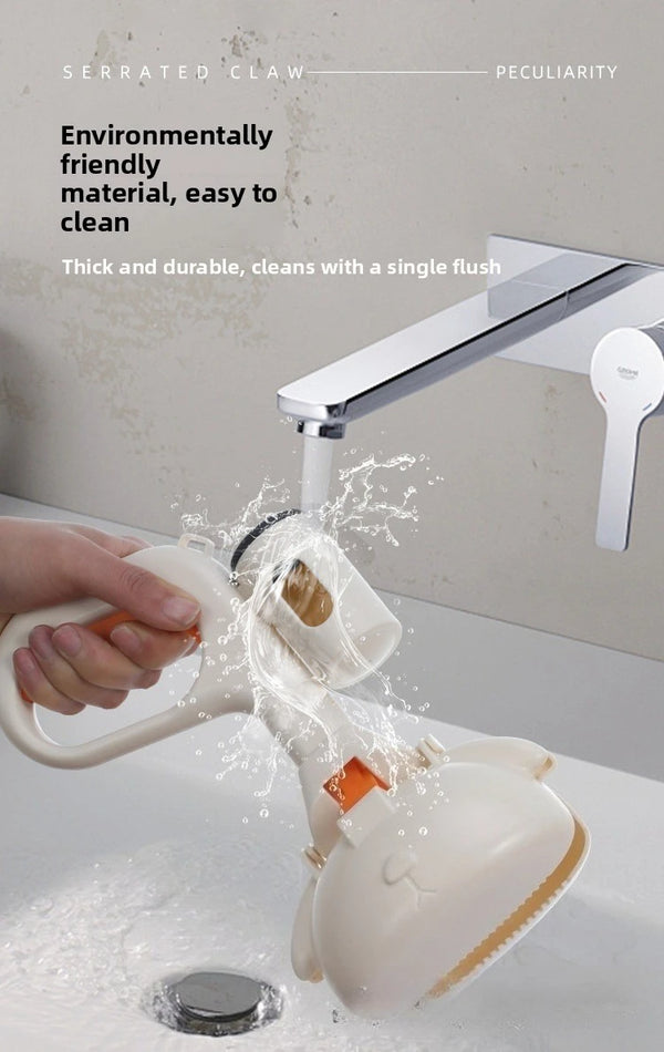 A hand is using a portable pet poop picker scooper with an ergonomic handle to clean a sink.