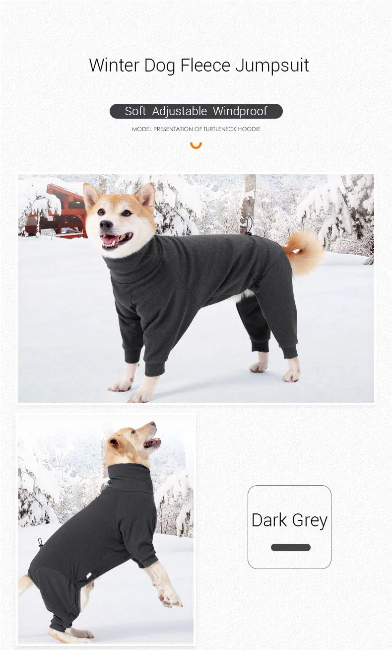 A dark grey fleece jumpsuit for a dog standing outdoors in the snow.