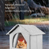 A white all-weather shelter for stray cats with an open entrance, shown outdoors.