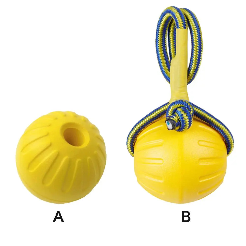 A yellow rubber fetch ball for dogs with a braided yellow and blue rope handle.