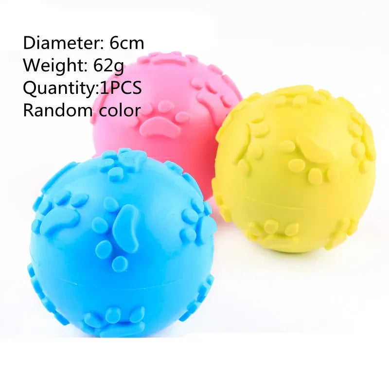 Three rubber chew toys in pink, yellow, and blue colors are shown on a white background.