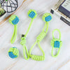 A collection of bright lime green rope toys with blue accents for dogs, including a looped toy and a ball-shaped toy.