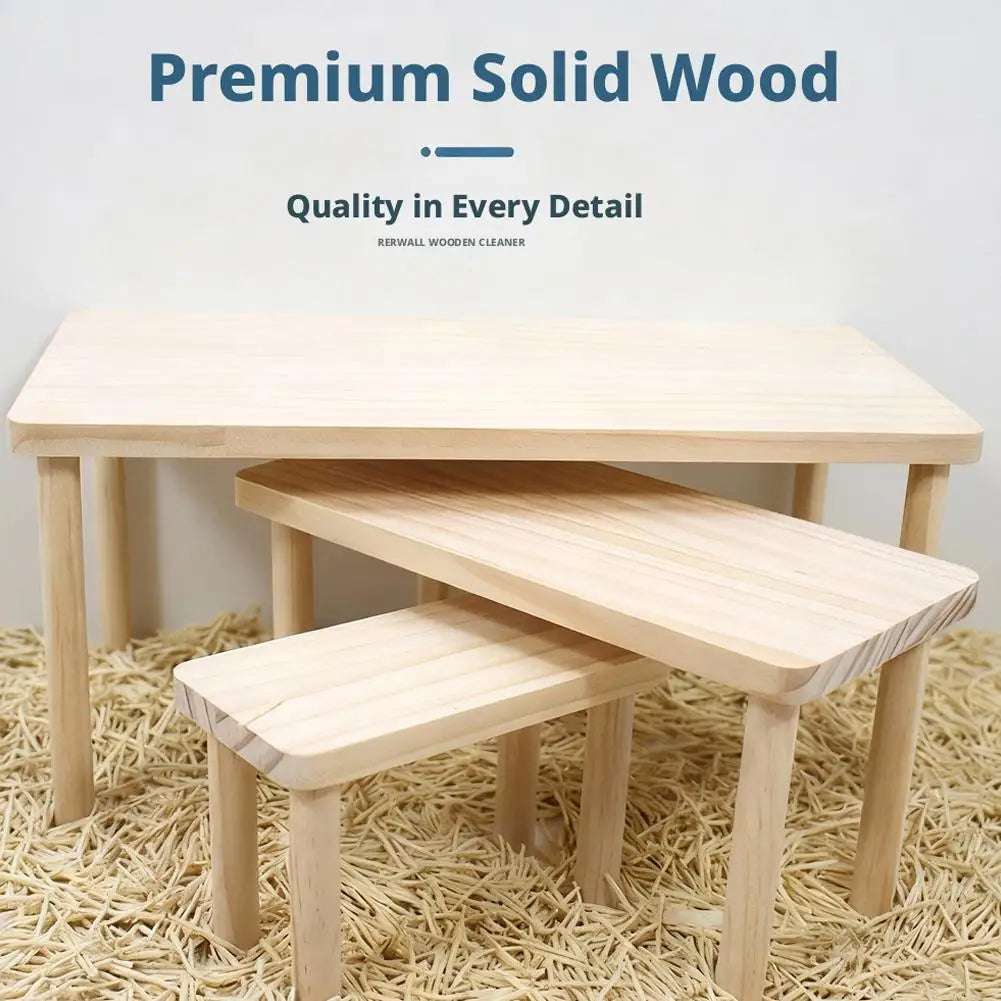 A light wood hamster climbing platform is shown resting on a natural fiber surface.